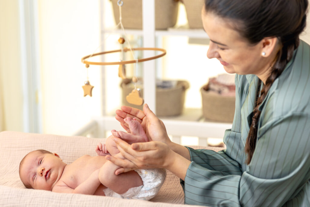 parent holding hands feet newborn baby mom holding baby feet